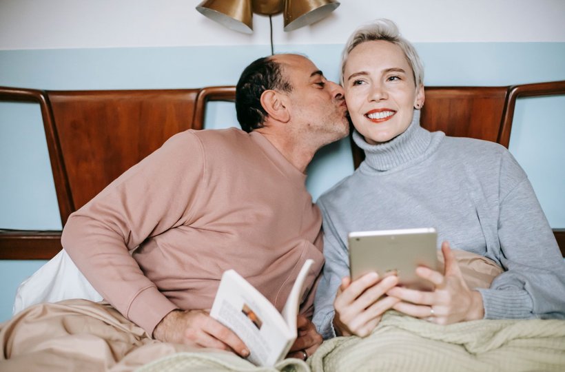 A couple reading together at home