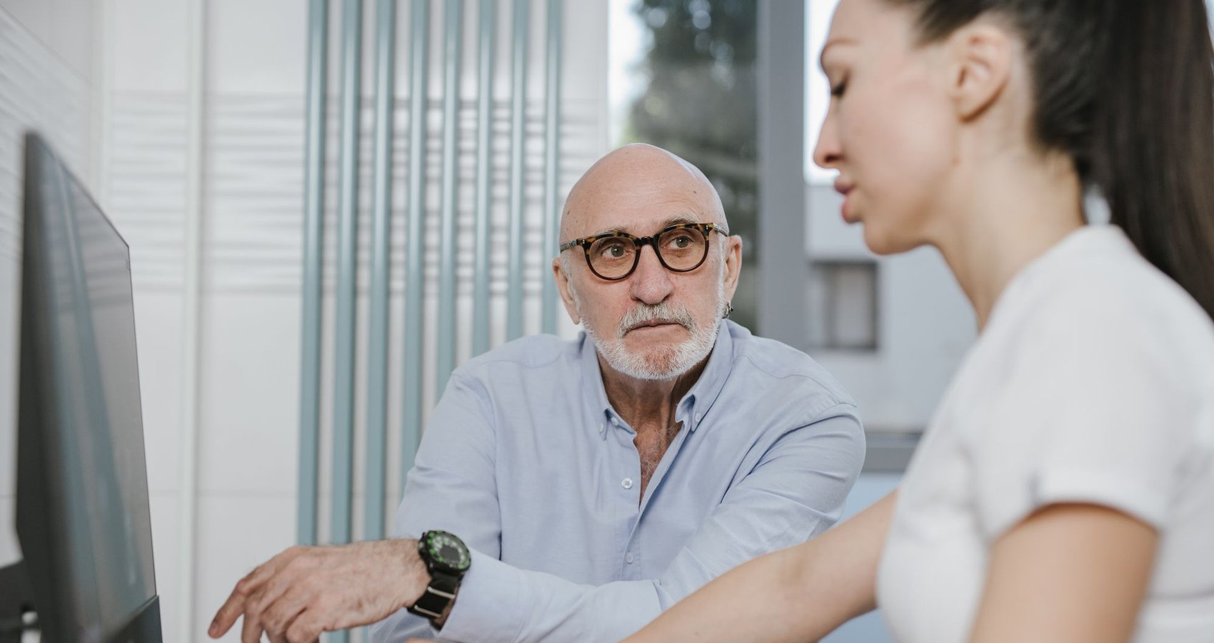 A man talking through his results with a clinician
