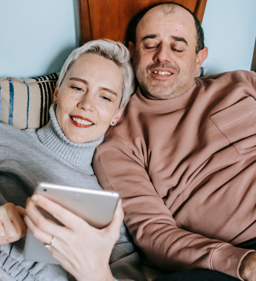 A couple relaxing together at home