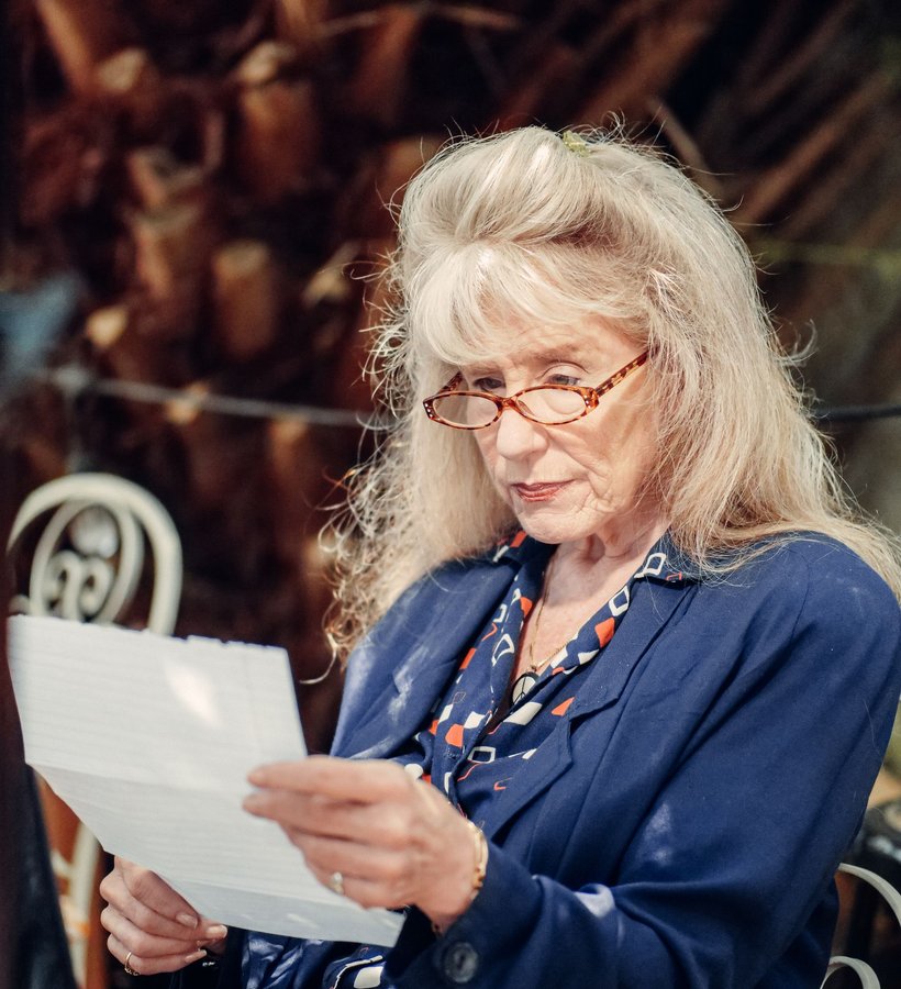 A woman reading a letter